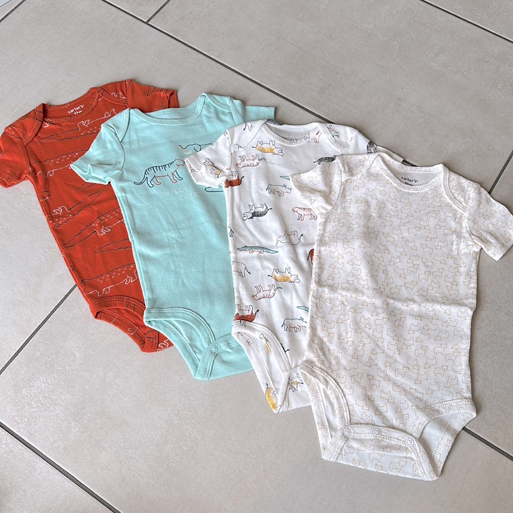 Four 12M Carter’s Onesies